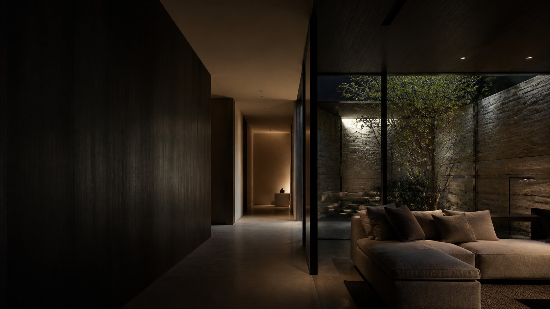 Interior residencial contemporâneo em pedra, madeira e luz indireta